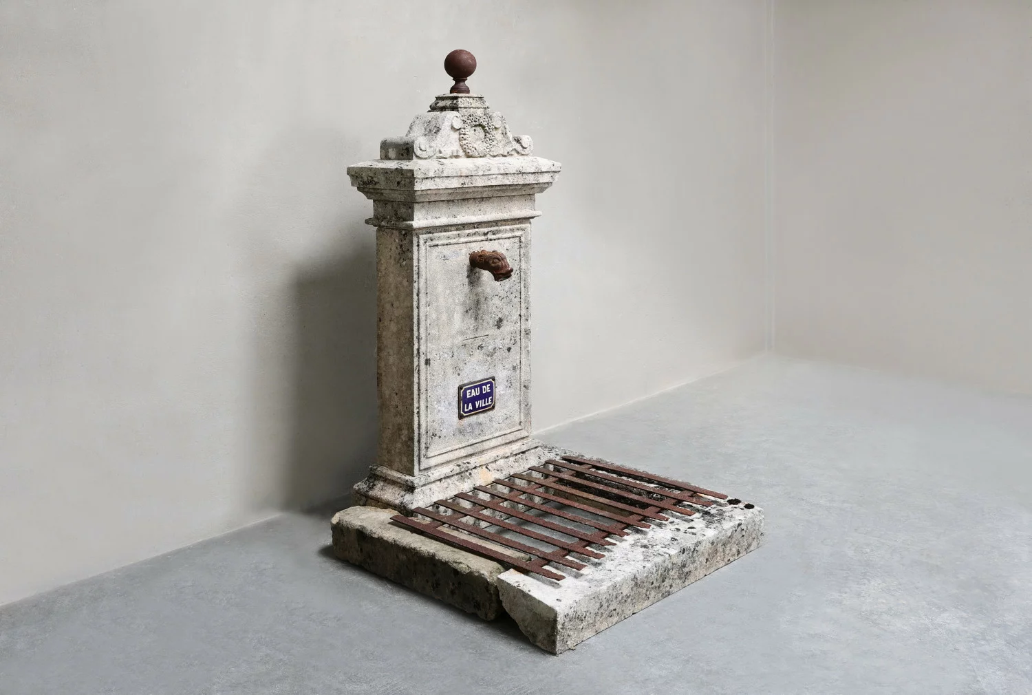 fontein van kalksteen en gietijzer